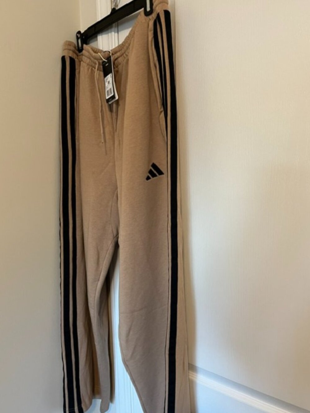 Adidas tan 3-stripe fleece sweatpants.